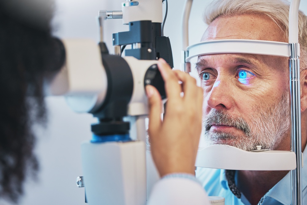 Patient receiving detailed eye examination with slit lamp before SMILE laser eye surgery – smile eye surgery mesa