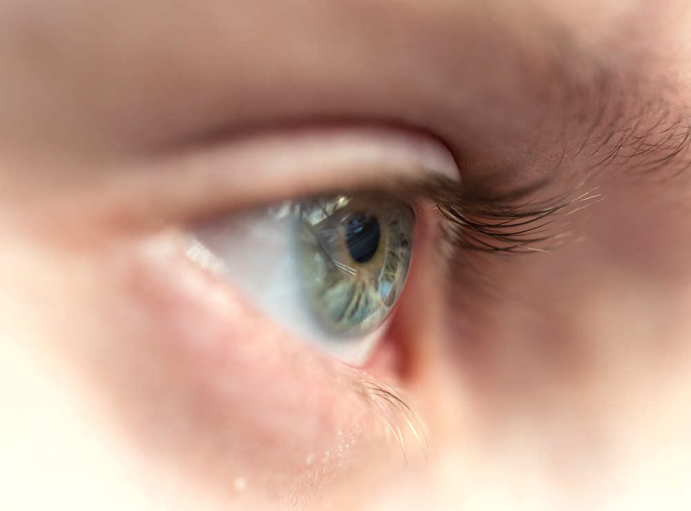 Detailed close-up of a human eye highlighting iris and eyelashes during an eye exam – Ophthalmologist Costa Mesa